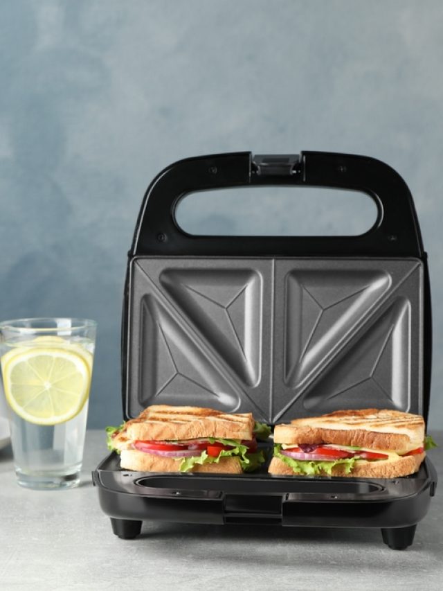 Modern,Grill,Maker,With,Sandwiches,And,Breakfast,Served,On,Grey